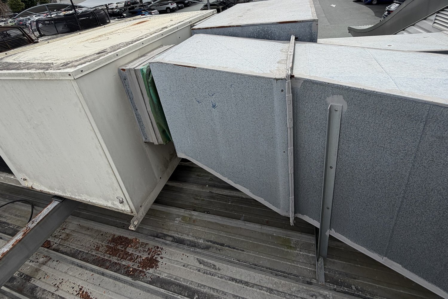 Packaged rooftop air conditioning unit and ductwork on a commercial roof